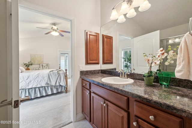 bathroom with vanity, lofted ceiling, and ceiling fan with notable chandelier