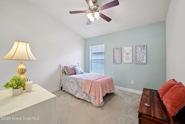 carpeted bedroom featuring vaulted ceiling and ceiling fan