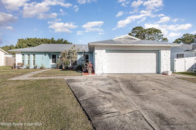 ranch-style house with a garage and a front lawn