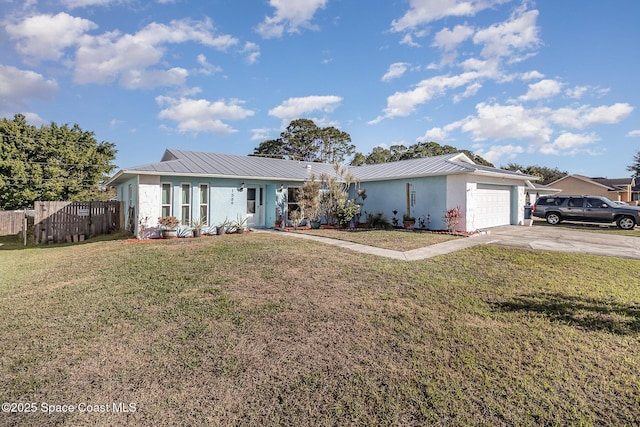 ranch-style home featuring a front lawn and a garage