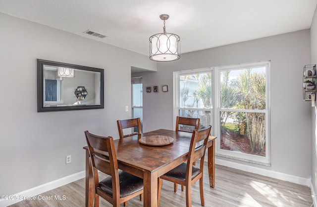 dining space featuring light hardwood / wood-style flooring