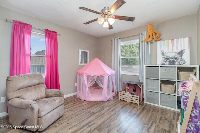 game room with ceiling fan and hardwood / wood-style floors