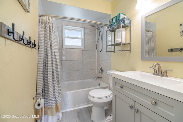 full bathroom featuring shower / tub combo, vanity, hardwood / wood-style flooring, and toilet