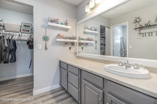 bathroom featuring vanity and wood-type flooring