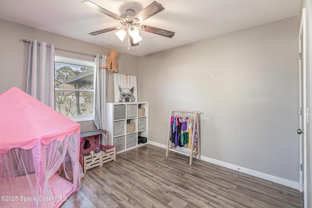 interior space with ceiling fan and hardwood / wood-style floors