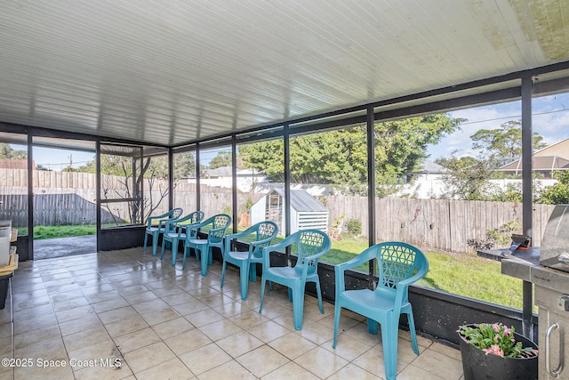 sunroom / solarium featuring a healthy amount of sunlight