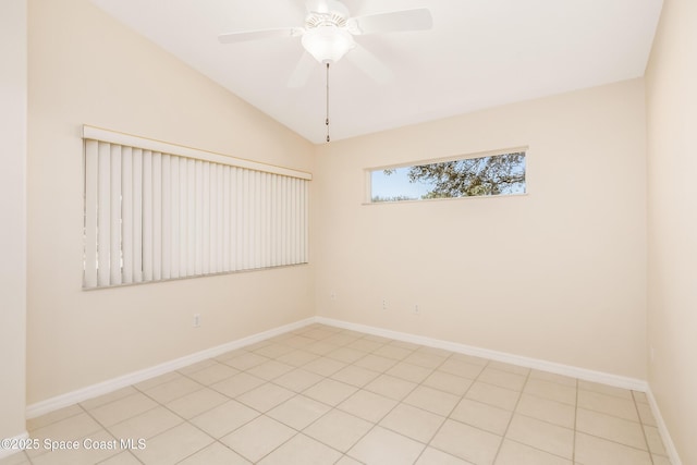 tiled spare room featuring ceiling fan and lofted ceiling