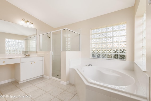 bathroom with shower with separate bathtub, vanity, tile patterned floors, and lofted ceiling