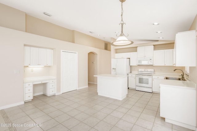 kitchen featuring white cabinets, a center island, white appliances, and pendant lighting