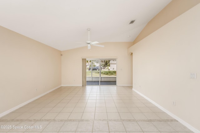 tiled spare room with ceiling fan and vaulted ceiling