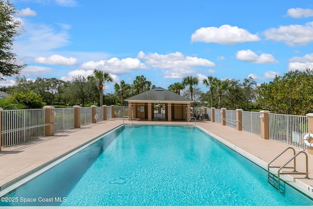 view of swimming pool with an outbuilding