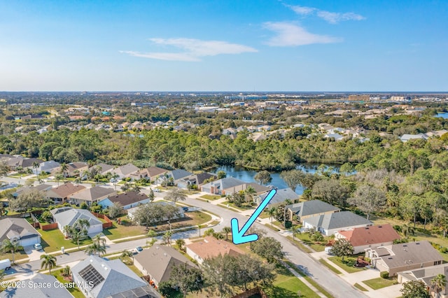 birds eye view of property featuring a water view