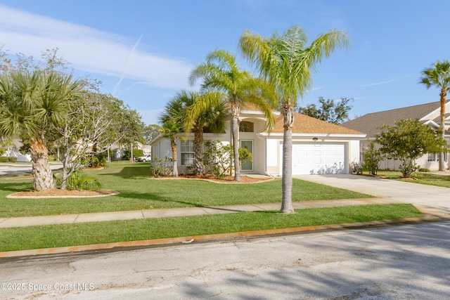 view of front of property featuring a garage and a front lawn