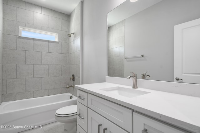 full bathroom with vanity, toilet, and tiled shower / bath combo