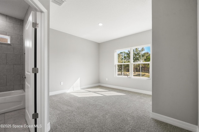 unfurnished room featuring carpet floors