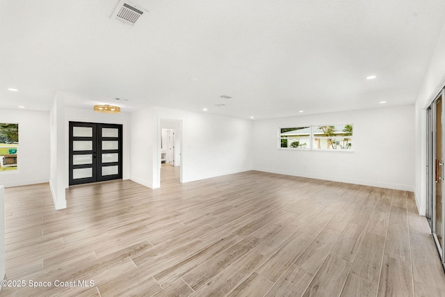 unfurnished living room featuring light wood-type flooring