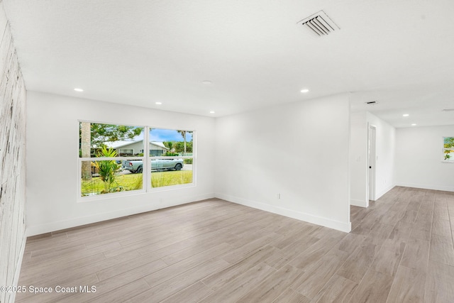 spare room featuring light wood-type flooring