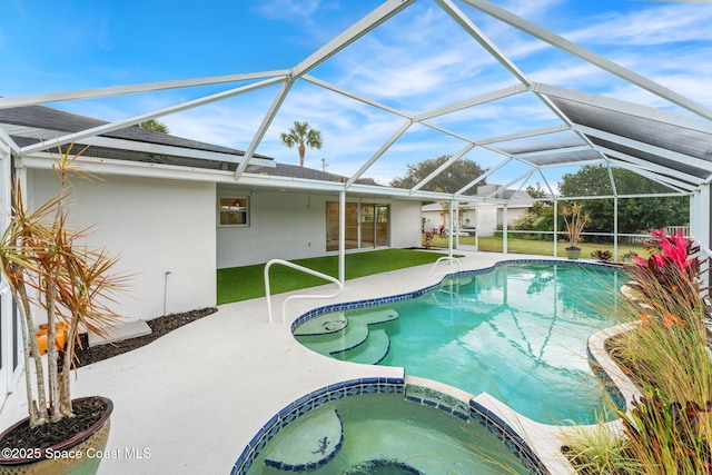 view of pool featuring glass enclosure, a patio area, and an in ground hot tub