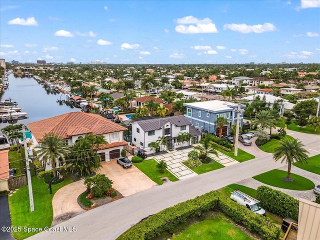 birds eye view of property with a water view