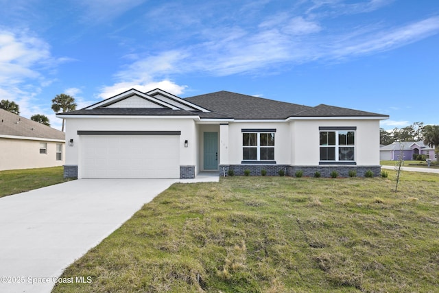 view of front of house featuring a front yard and a garage