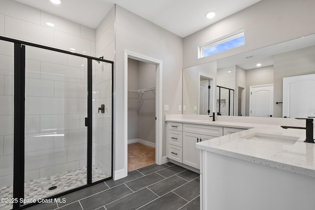 bathroom with vanity and walk in shower