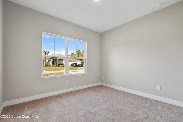 spare room featuring carpet floors