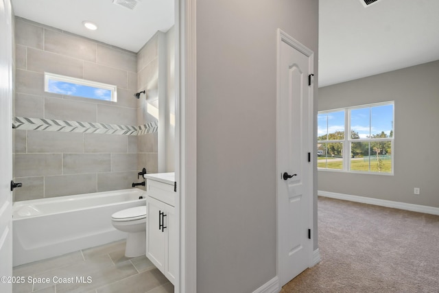 full bathroom with vanity, toilet, and tiled shower / bath