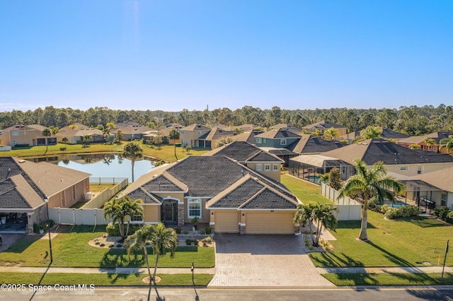 birds eye view of property with a water view