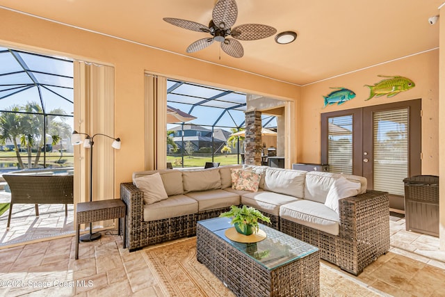 sunroom with french doors and ceiling fan