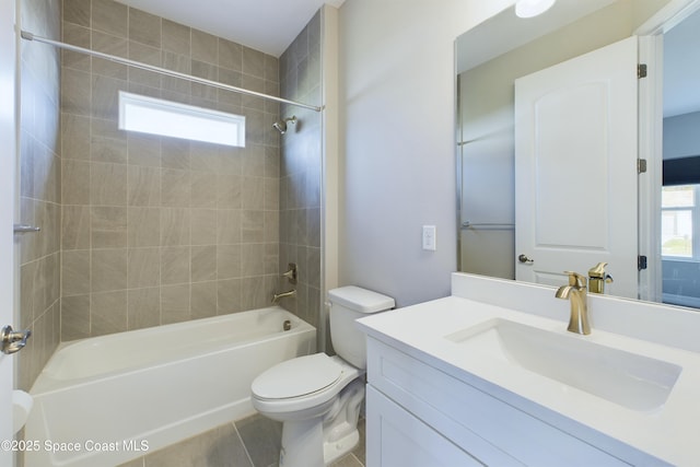 full bath with washtub / shower combination, tile patterned flooring, vanity, and toilet