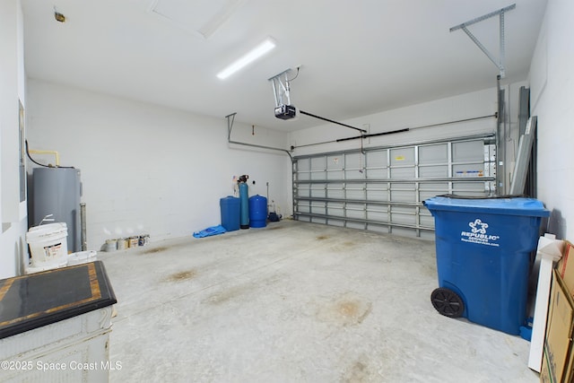 garage featuring electric water heater and a garage door opener