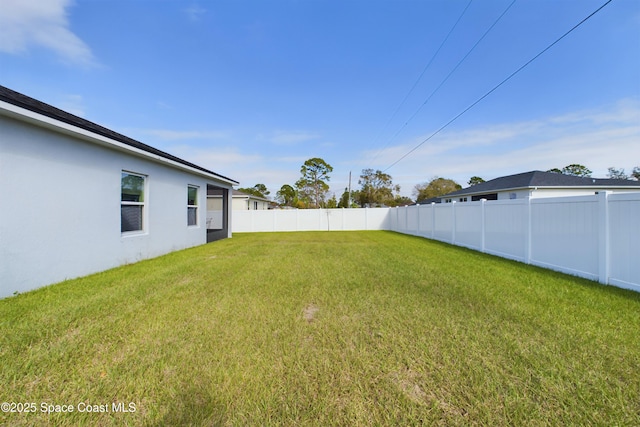 view of yard with a fenced backyard