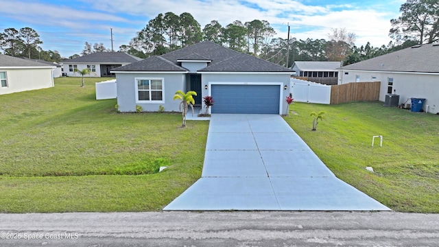 ranch-style home with cooling unit, a garage, and a front yard