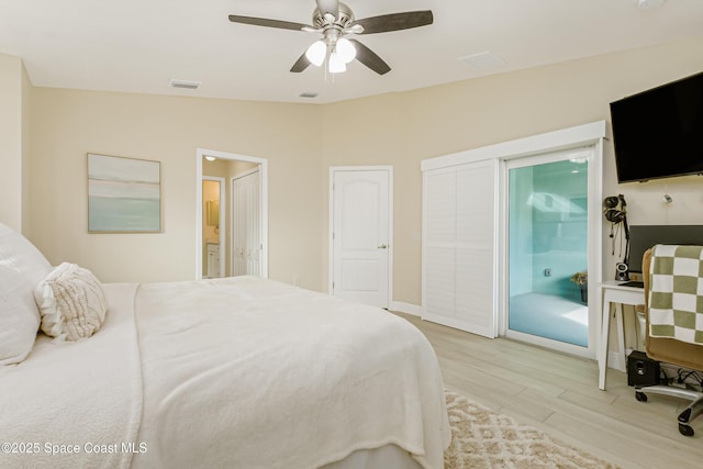 bedroom with connected bathroom, ceiling fan, light hardwood / wood-style floors, and lofted ceiling