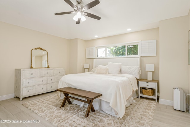 bedroom featuring light hardwood / wood-style flooring and ceiling fan