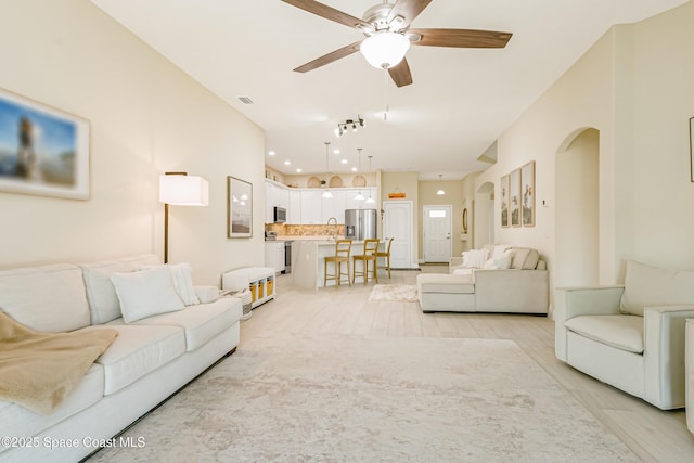 living room with ceiling fan