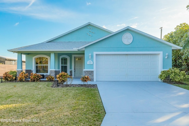 view of front of house featuring a garage and a front lawn