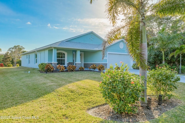 view of front of house featuring a front yard and a garage