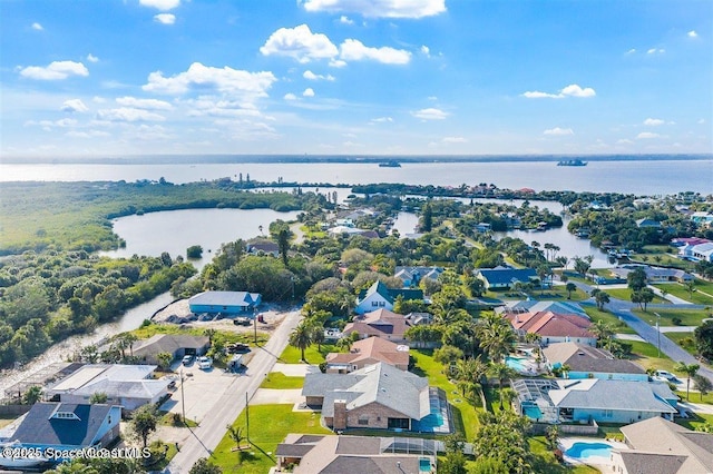 bird's eye view with a water view