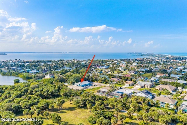 bird's eye view with a water view