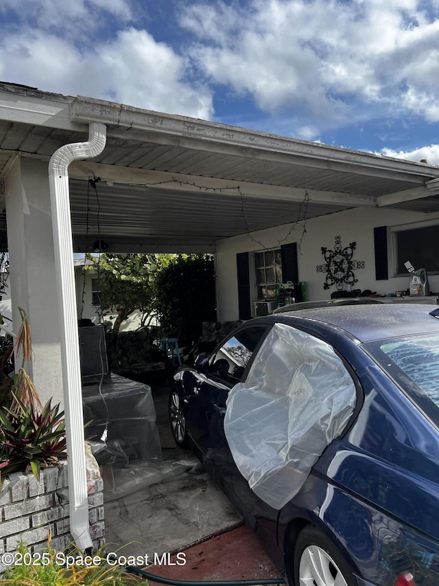 view of parking / parking lot featuring a carport