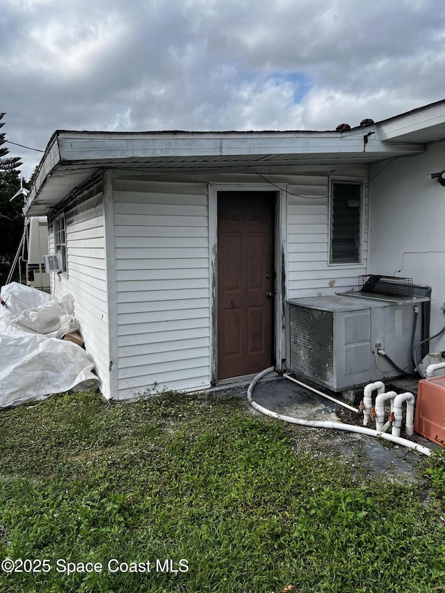 view of outbuilding featuring central AC unit