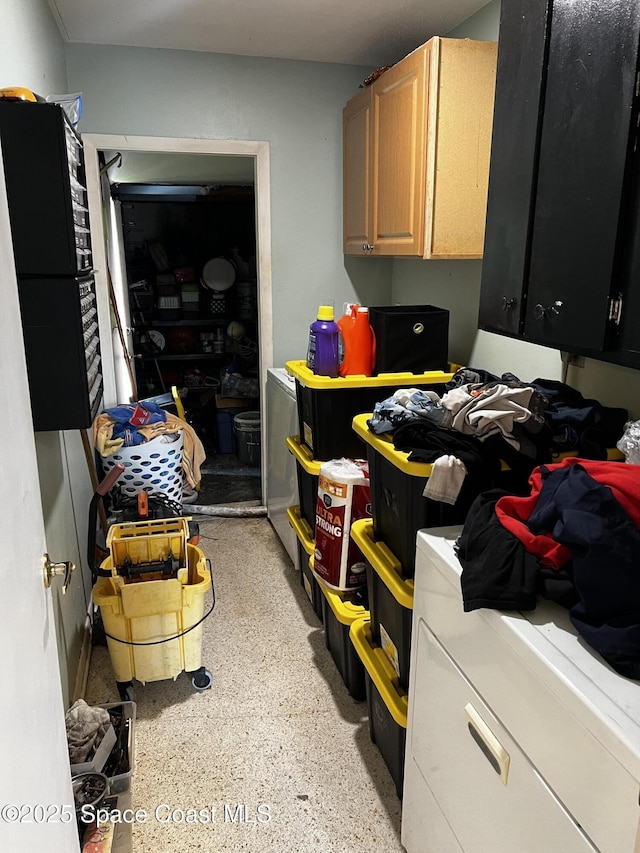 laundry area with cabinets