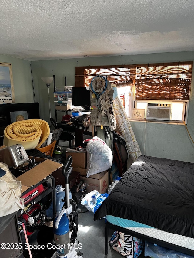 bedroom with cooling unit and a textured ceiling