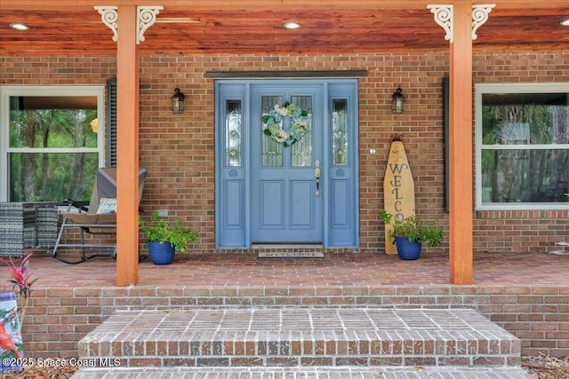 doorway to property featuring a porch