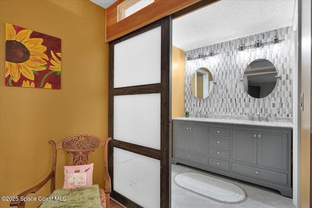 bathroom featuring vanity and a textured ceiling