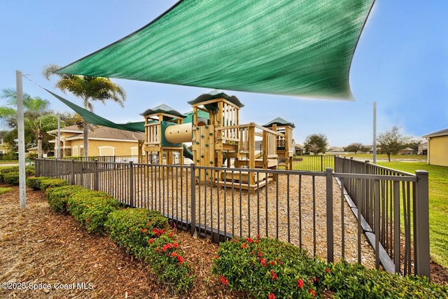 view of jungle gym with fence