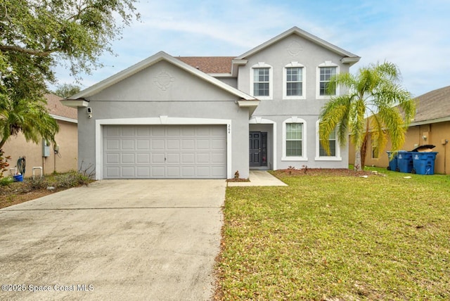 view of front of house with a garage and a front yard