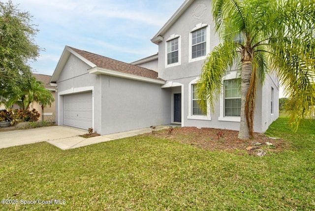 view of property featuring a garage and a front yard