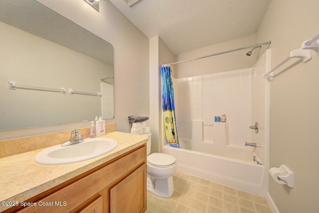 bathroom with a textured ceiling, vanity, shower / bath combo with shower curtain, and toilet